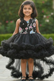 Black Party Frock with Floral Bodice and Ruffled Hemline And Tailback For Girls