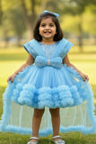 Blue Party Frock With Layered Ruffles And Statement Bow and Tailback For Girls