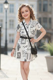 Cream And Black Abstract Printed Dress With Belt And Bag For Girls