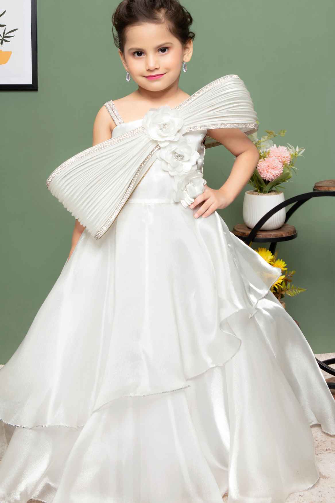 White Party Wear Gown With Floral And Bow Embellishment For Girls