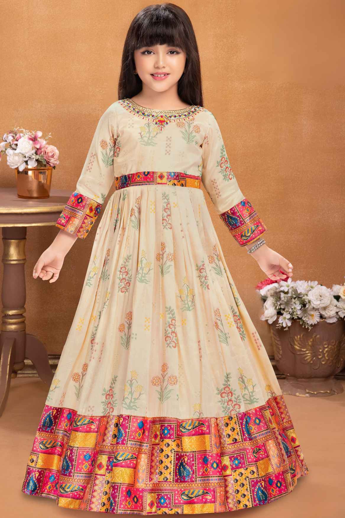 Designer Beige And Rani Pink Floral Printed Ethnic Gown With Multicolor Borders For Girls
