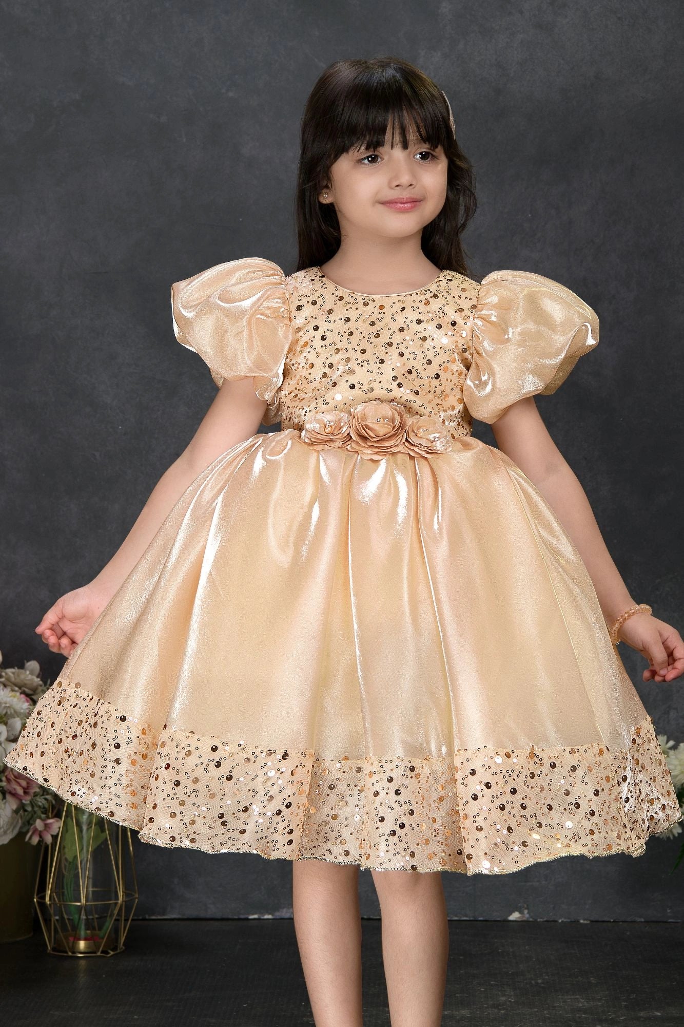 Golden Sequin Party Wear Frock with Puffy Sleeves and Floral Waist Detail For Girls 6-12M (16) Golden Sequin Party Wear Frock with Puffy Sleeves and Floral Waist Detail For Girls 6-12M (16)