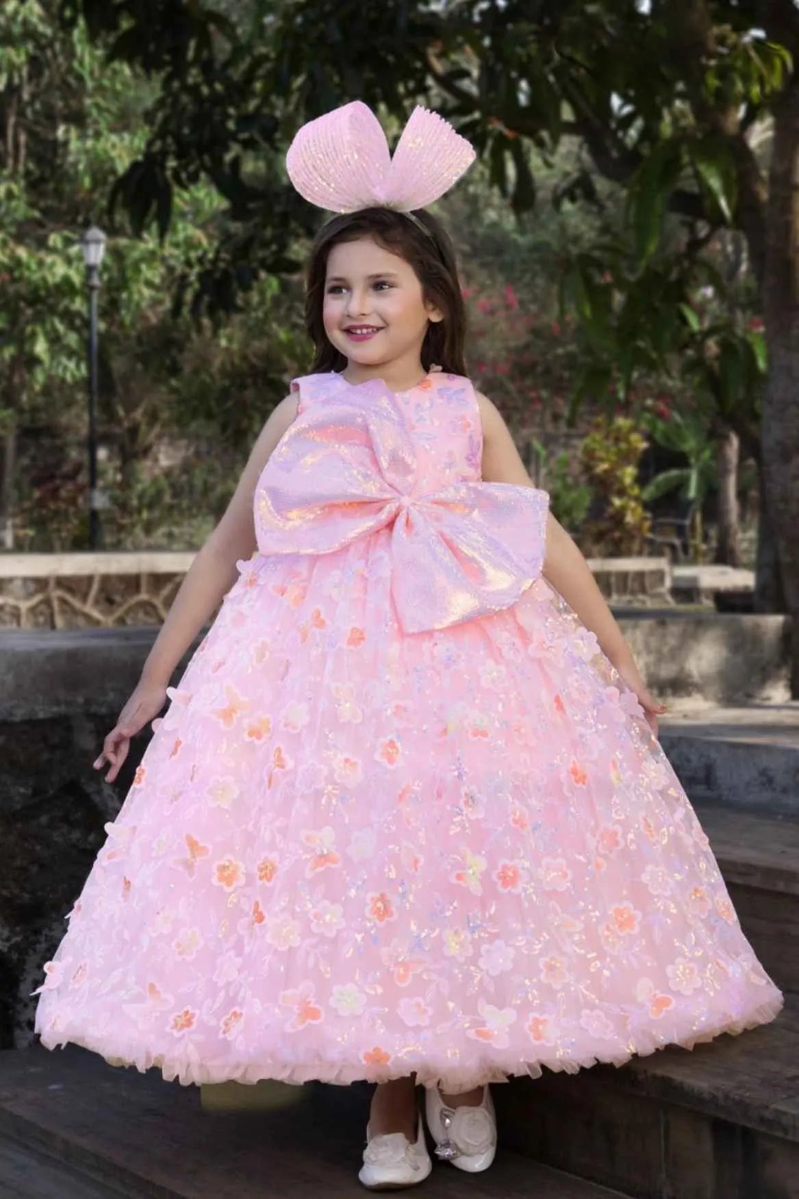 Peach Party Wear Gown With Sequin Flowers And Giant Bow For Girls