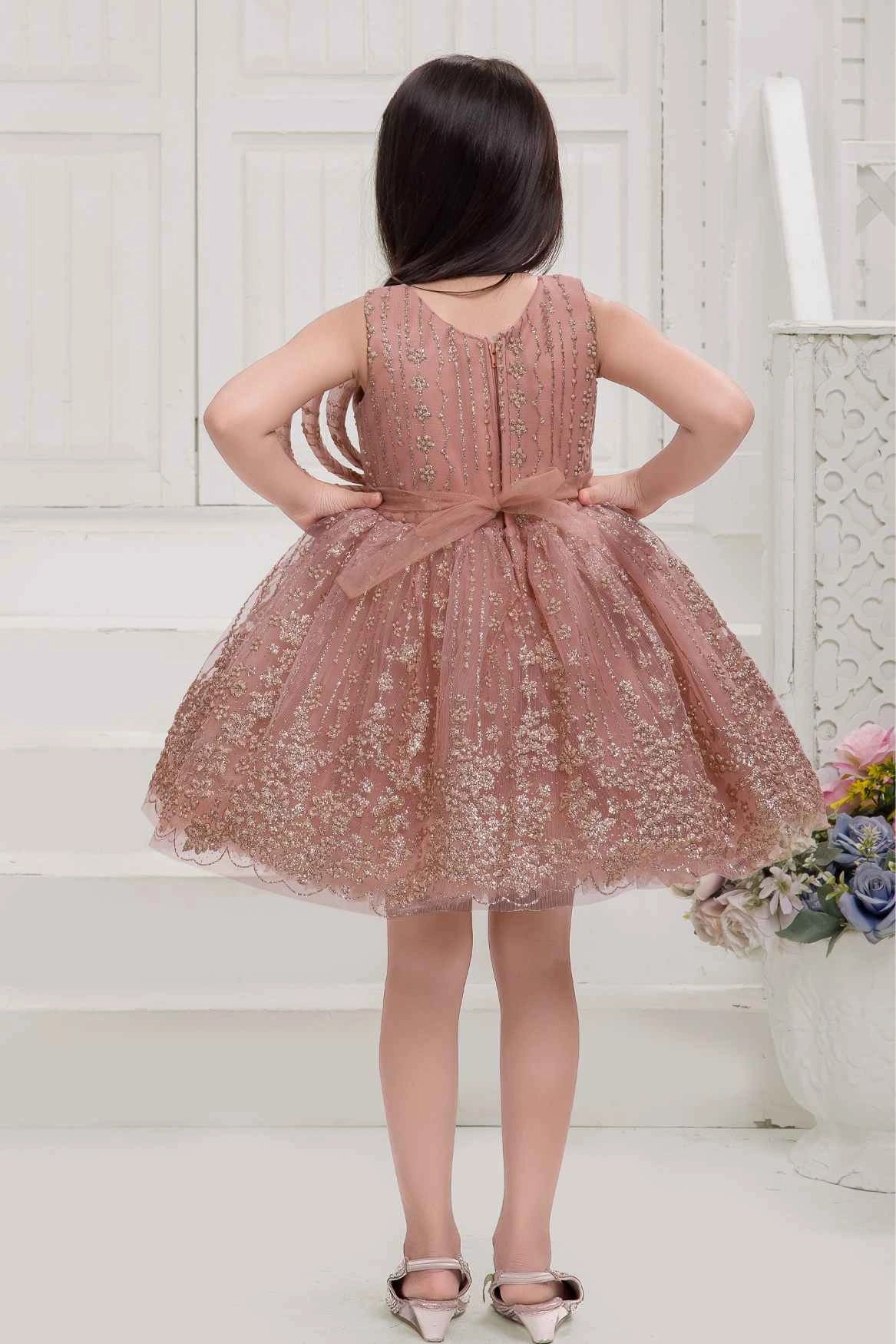 Peach Frock With Bow Embellished And Shimmer Printed For Girls