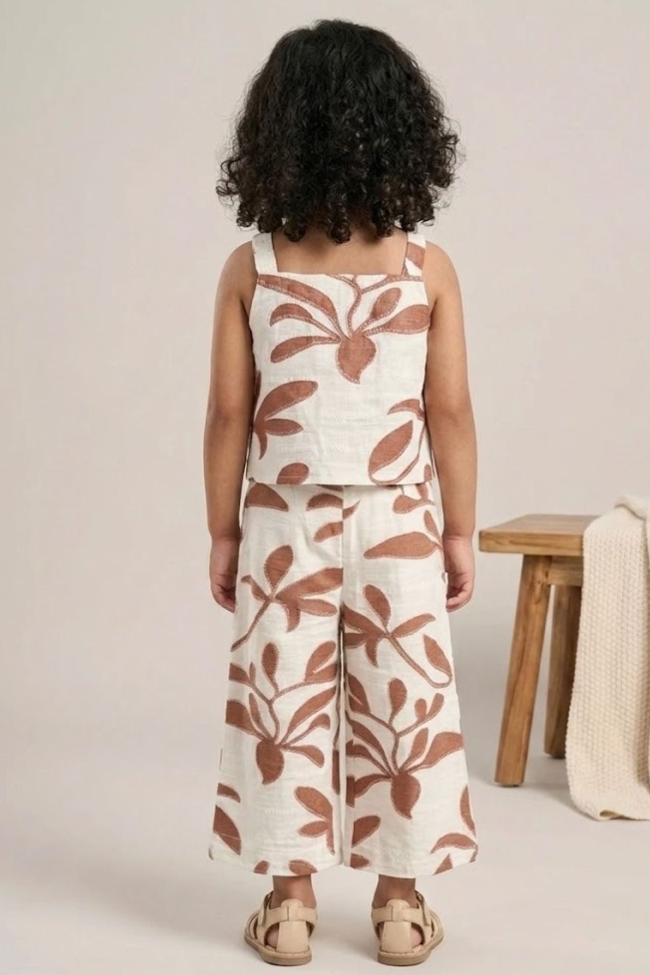 Girls White And Brown Floral Printed Co-Ord Set with Sleeveless Bow Strap Top And Flared Pants