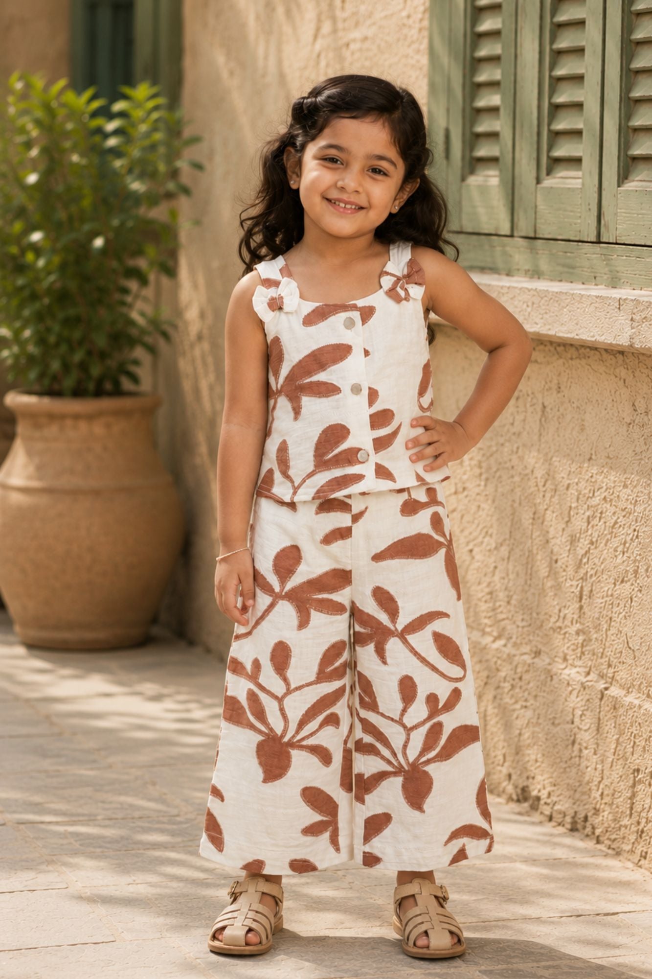 Girls White And Brown Floral Printed Co-Ord Set with Sleeveless Bow Strap Top And Flared Pants