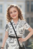 Cream And Black Abstract Printed Dress With Belt And Bag For Girls