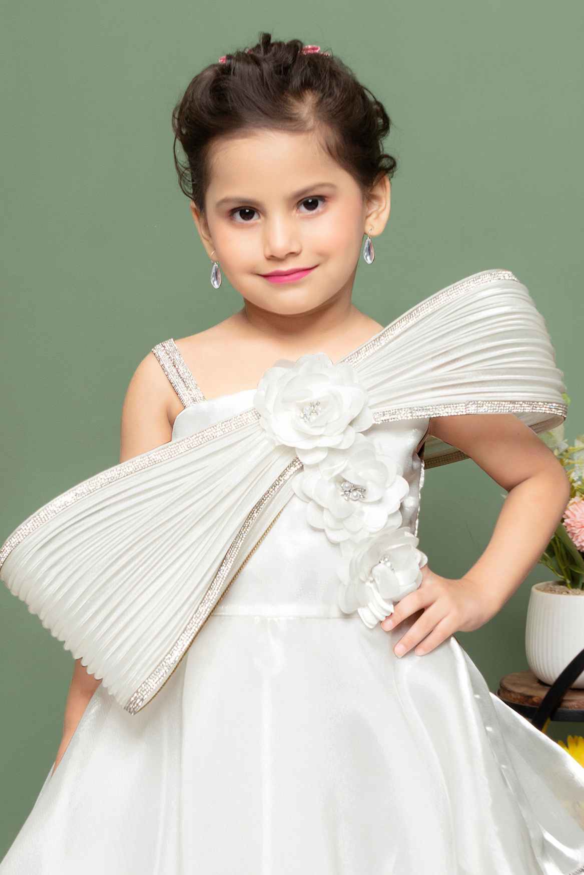 White Party Wear Gown With Floral And Bow Embellishment For Girls