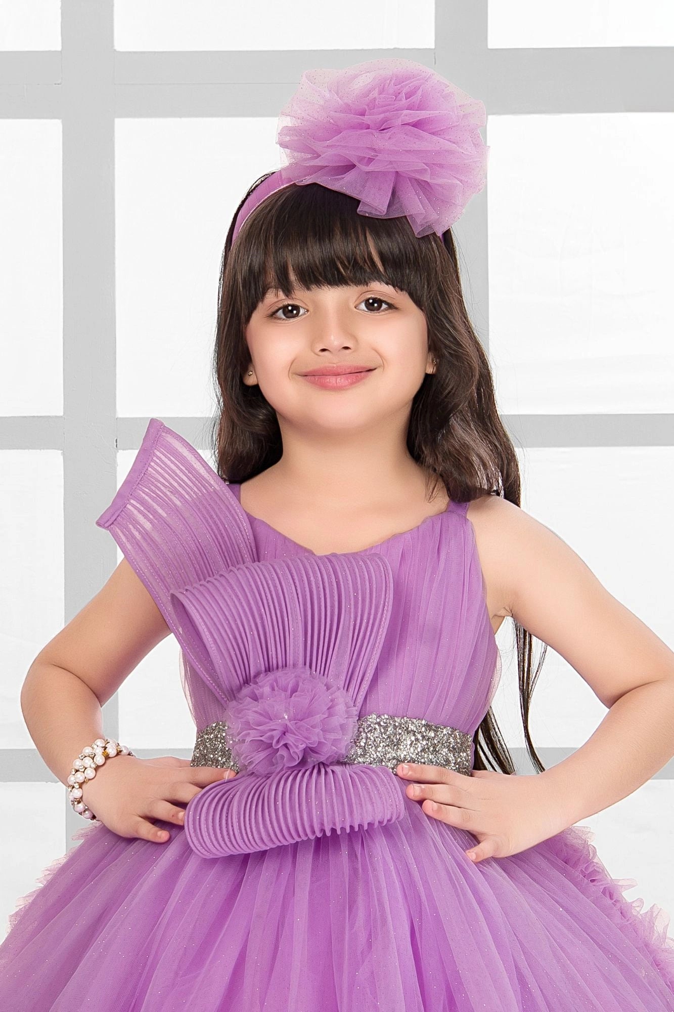 Lavender Embellished Party Wear Frock with Pleated Bodice and 3D Ruffle Hemline For Girls