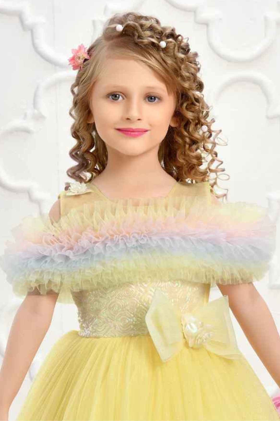 Yellow Ruffle Net Gown With Bow Embellishment For Girls