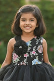Black Party Frock with Floral Bodice and Ruffled Hemline And Tailback For Girls