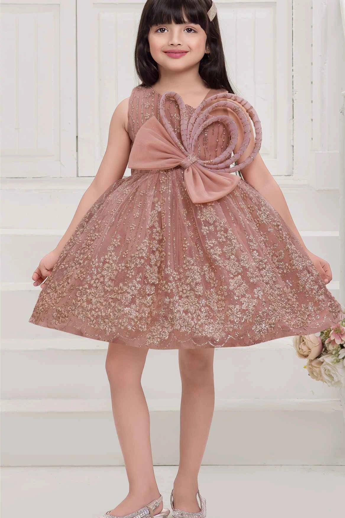 Peach Frock With Bow Embellished And Shimmer Printed For Girls