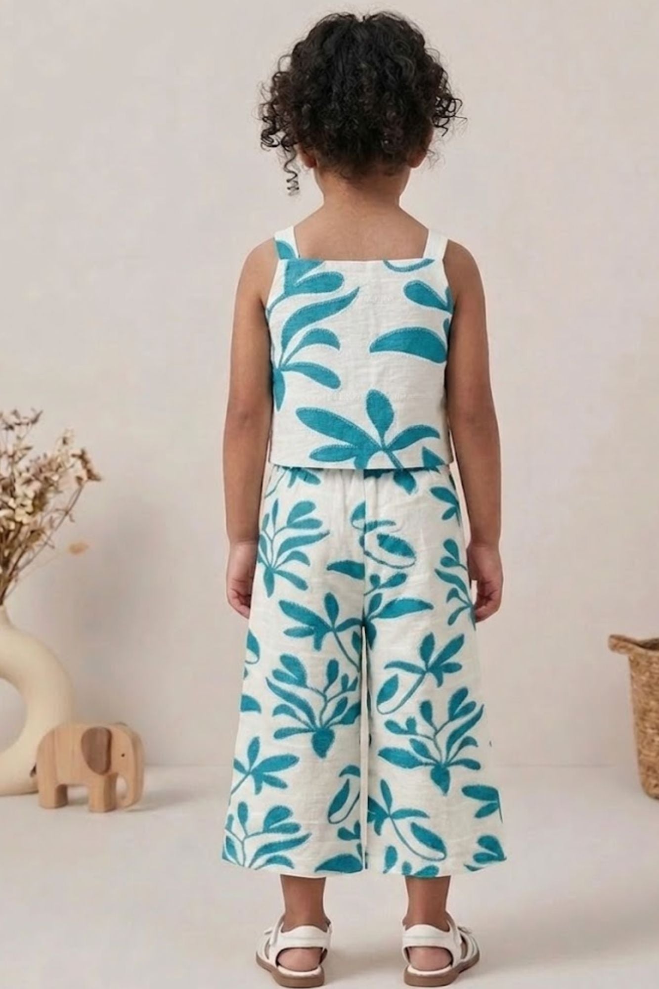 Girls White And Blue Floral Printed Co-Ord Set with Sleeveless Bow Strap Top And Flared Pants
