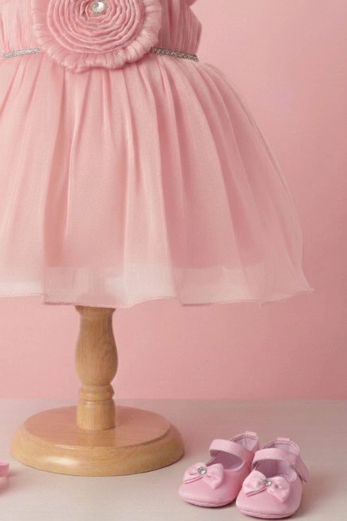 Peach Party Frock with Pleated Flower Appliqué and Shimmer Finish For Girls
