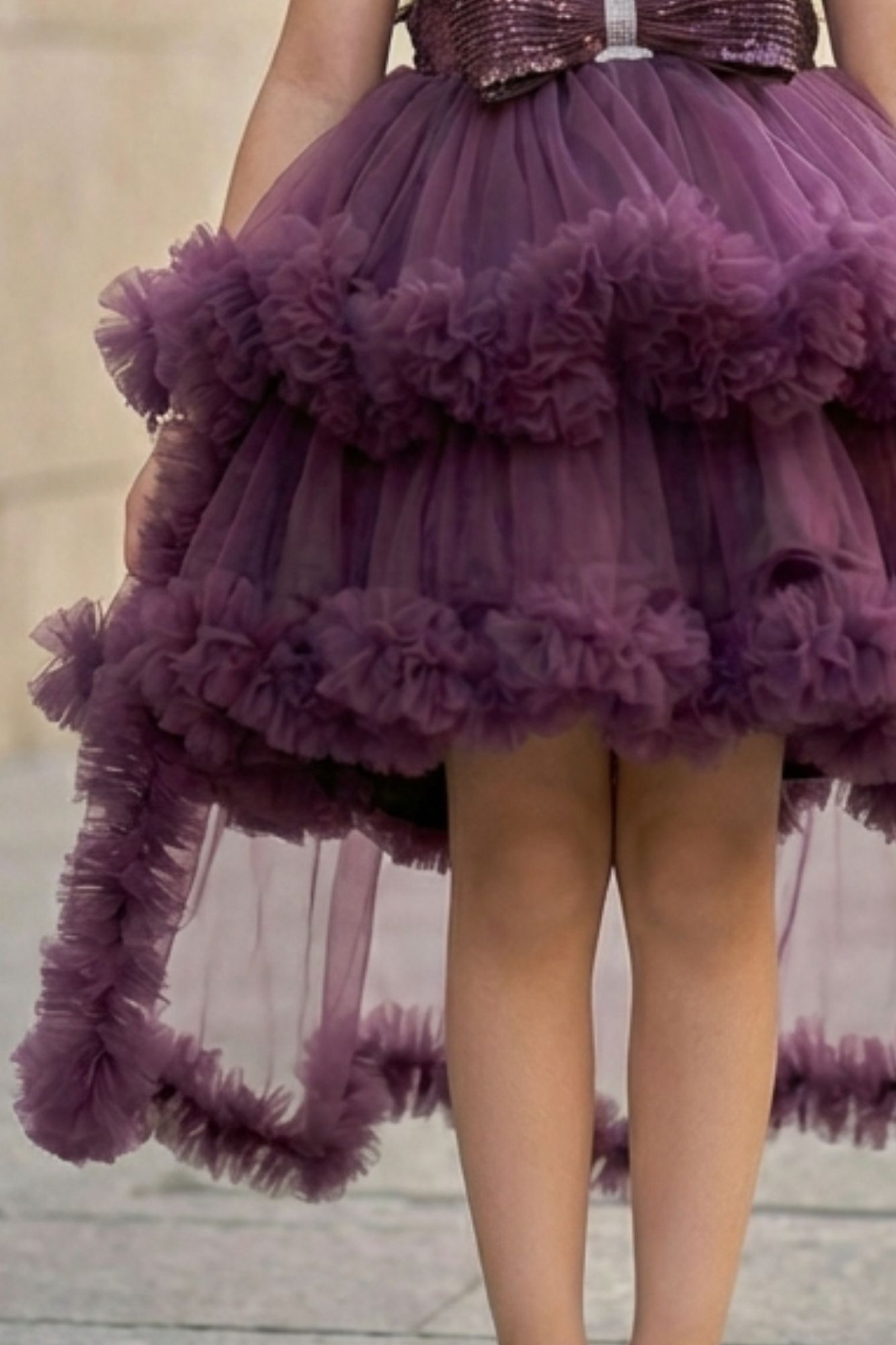 Plum Purple High-Low Party Wear Tulle Frock With Floral Embellishment For Girls
