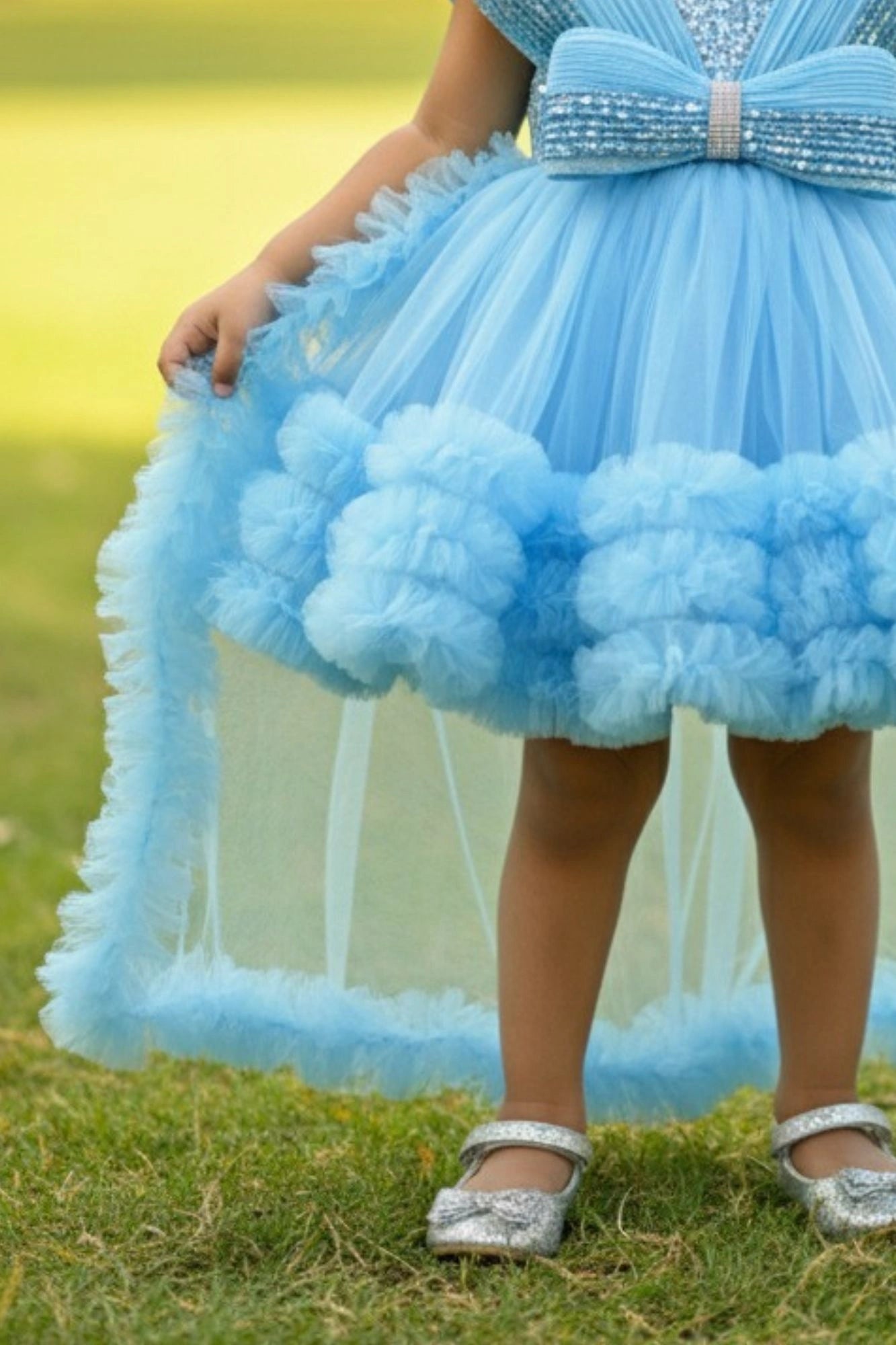 Blue Party Frock With Layered Ruffles And Statement Bow and Tailback For Girls