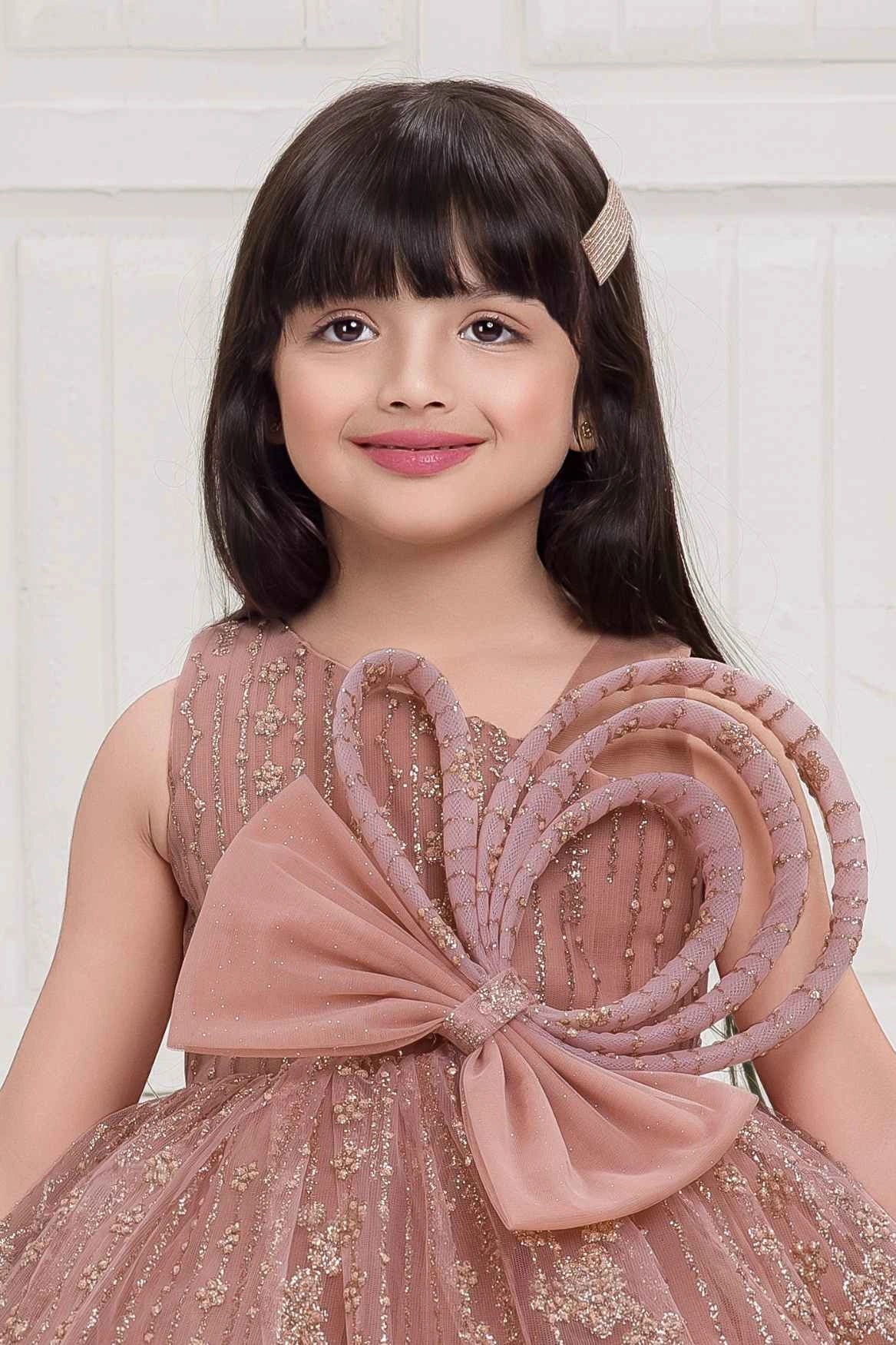 Peach Frock With Bow Embellished And Shimmer Printed For Girls