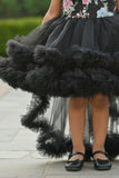 Black Party Frock with Floral Bodice and Ruffled Hemline And Tailback For Girls