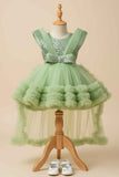 Pastel Green Party Frock With Layered Ruffles And Statement Bow and Tailback For Girls