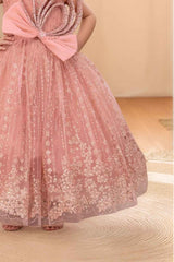 Peach Gown With Bow Embellished And Shimmer Printed For Girls