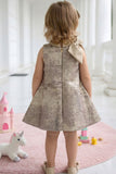Girls Champagne Gold Shimmer Party Wear Frock with Statement Bow Detail