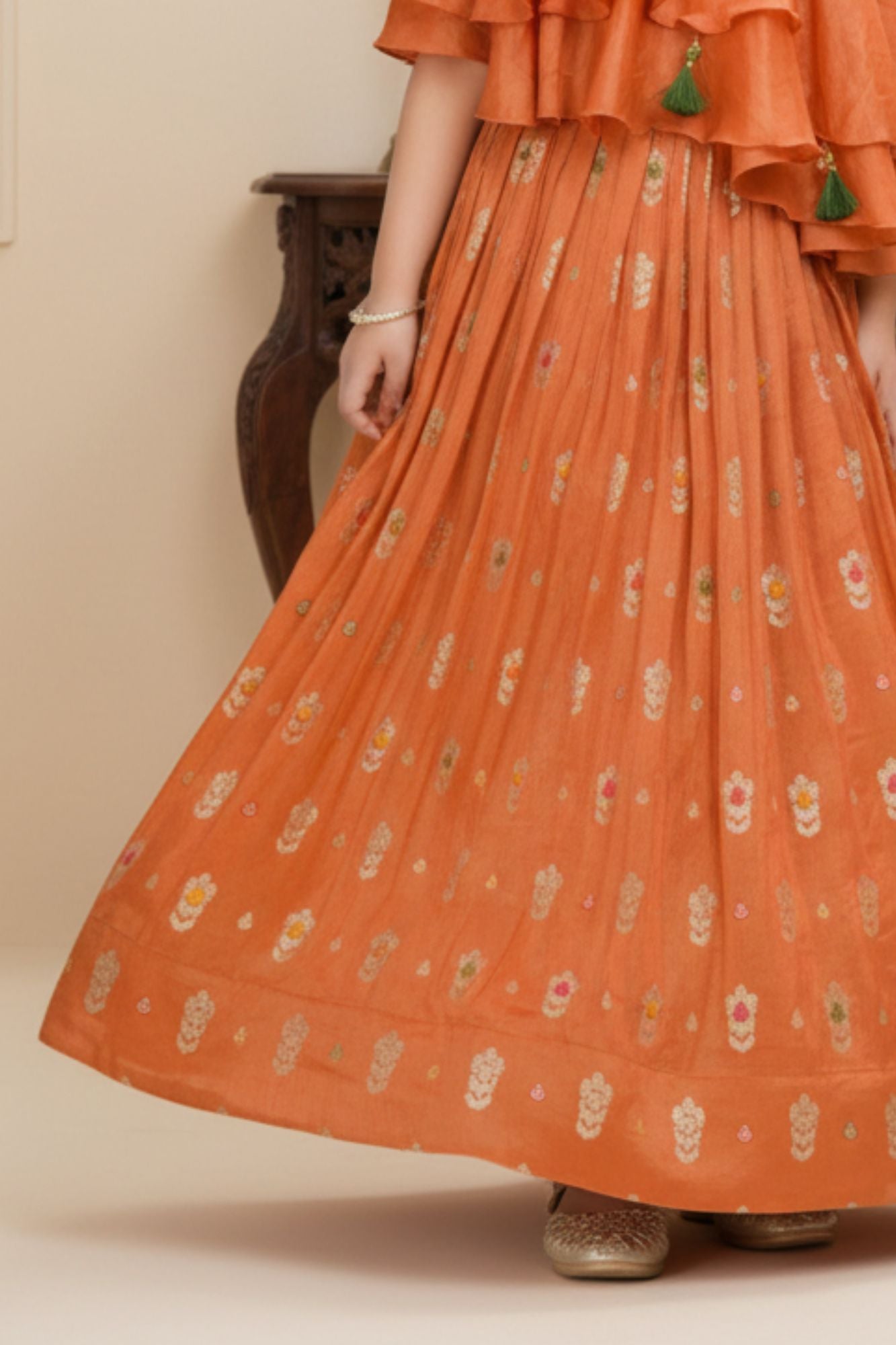 Orange One-Shoulder Ruffled Lehenga Set with Gold Foil Motifs For Girls
