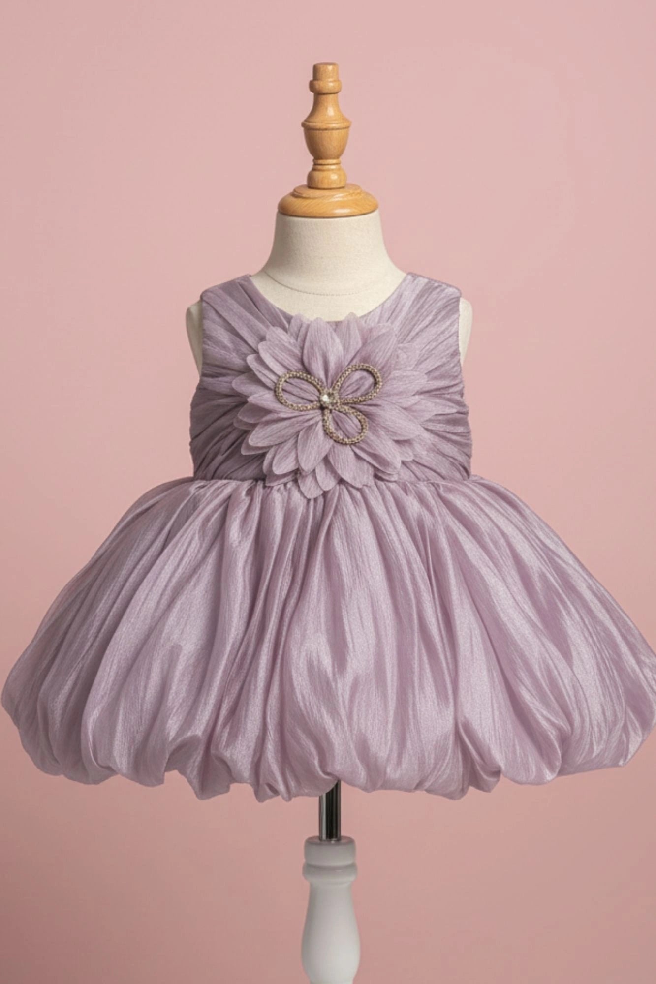 Mauve Party Frock with Oversized Floral Appliqué and Pleated Shine Finish For Girls