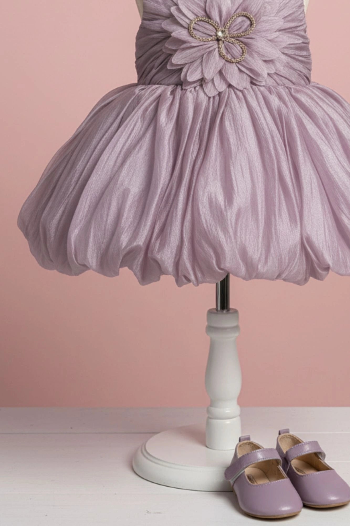 Mauve Party Frock with Oversized Floral Appliqué and Pleated Shine Finish For Girls