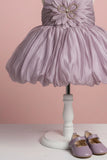 Mauve Party Frock with Oversized Floral Appliqué and Pleated Shine Finish For Girls