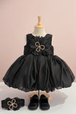 Black Party Frock with Oversized Floral Appliqué and Pleated Shine Finish For Girls