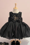 Black Party Frock with Oversized Floral Appliqué and Pleated Shine Finish For Girls