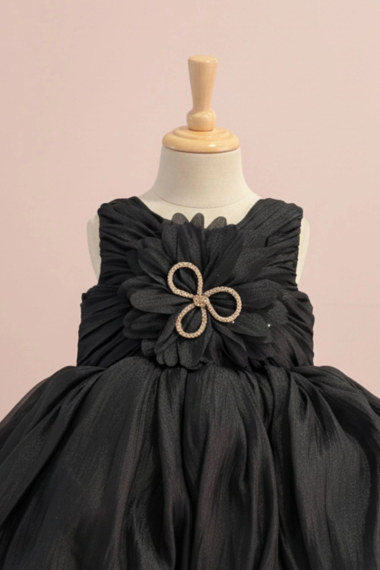Black Party Frock with Oversized Floral Appliqué and Pleated Shine Finish For Girls