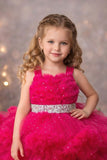 Girls Rani Pink High-Low Party Frock with Ruffled Layers And Embellished Waistbelt