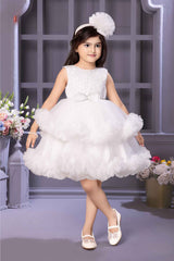 White Sleeveless With Pearl Work And Bow Embellishment Layer Frock For Girls