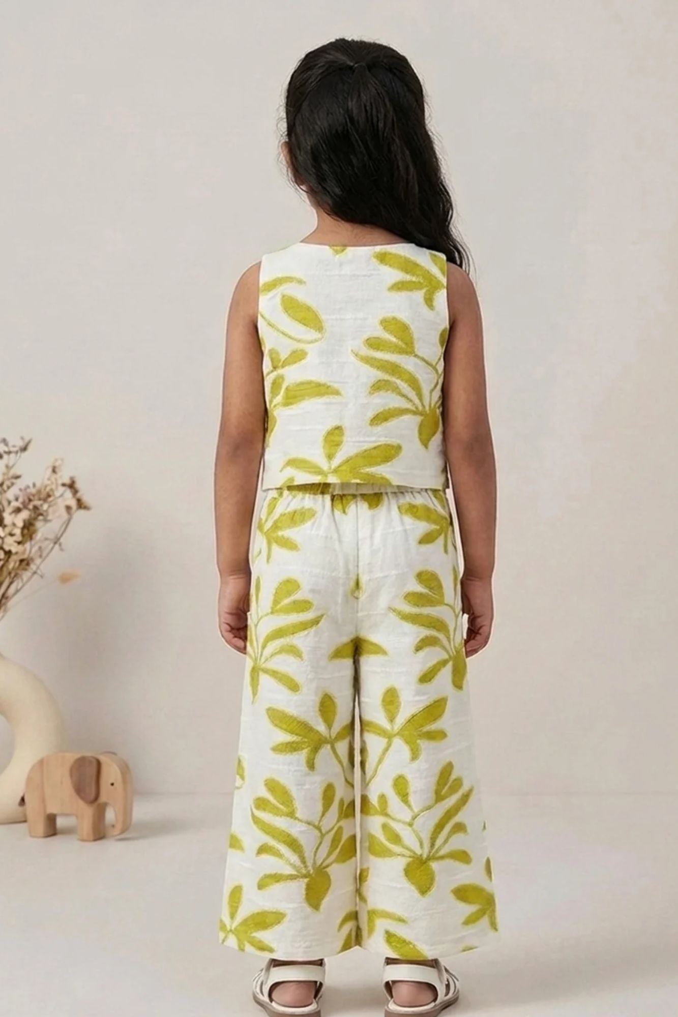 Girls White And Green Floral Printed Co-Ord Set with Sleeveless Bow Strap Top And Flared Pants