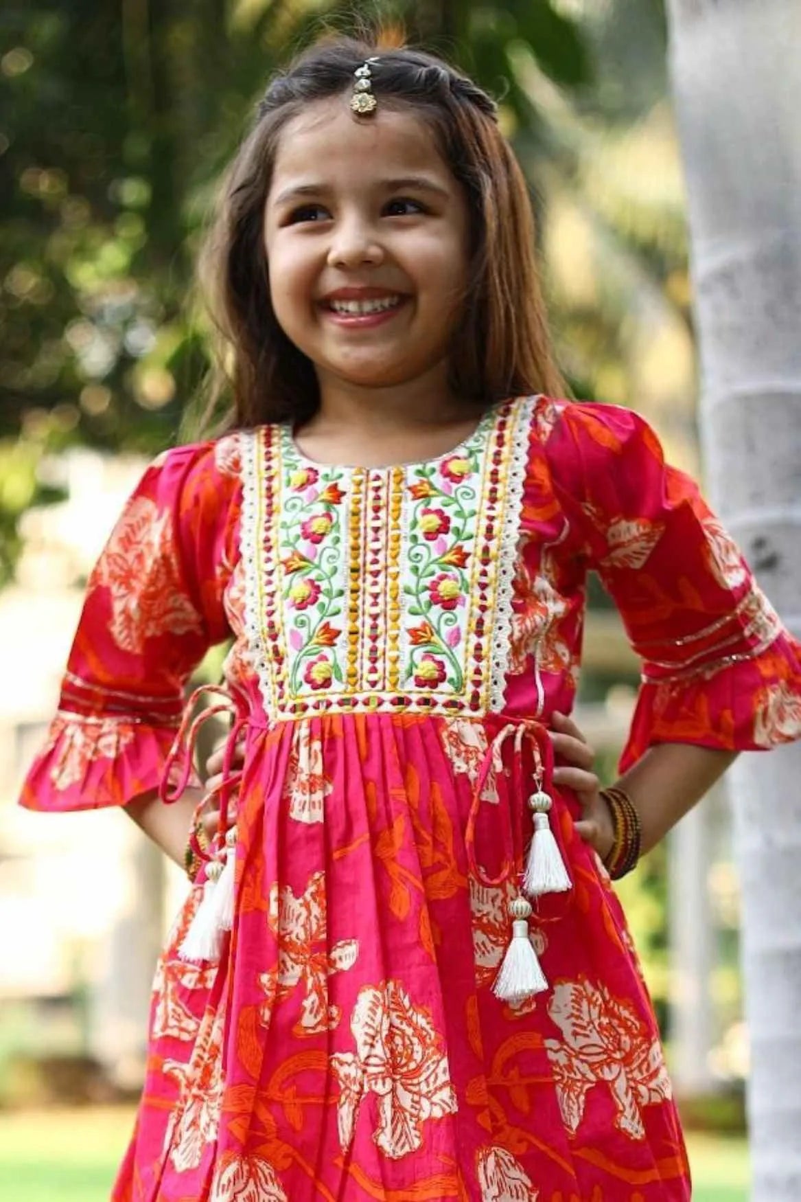 Red Floral Printed Sharara Set with Embroidered Yoke and Tassel Tie-Ups For Girls