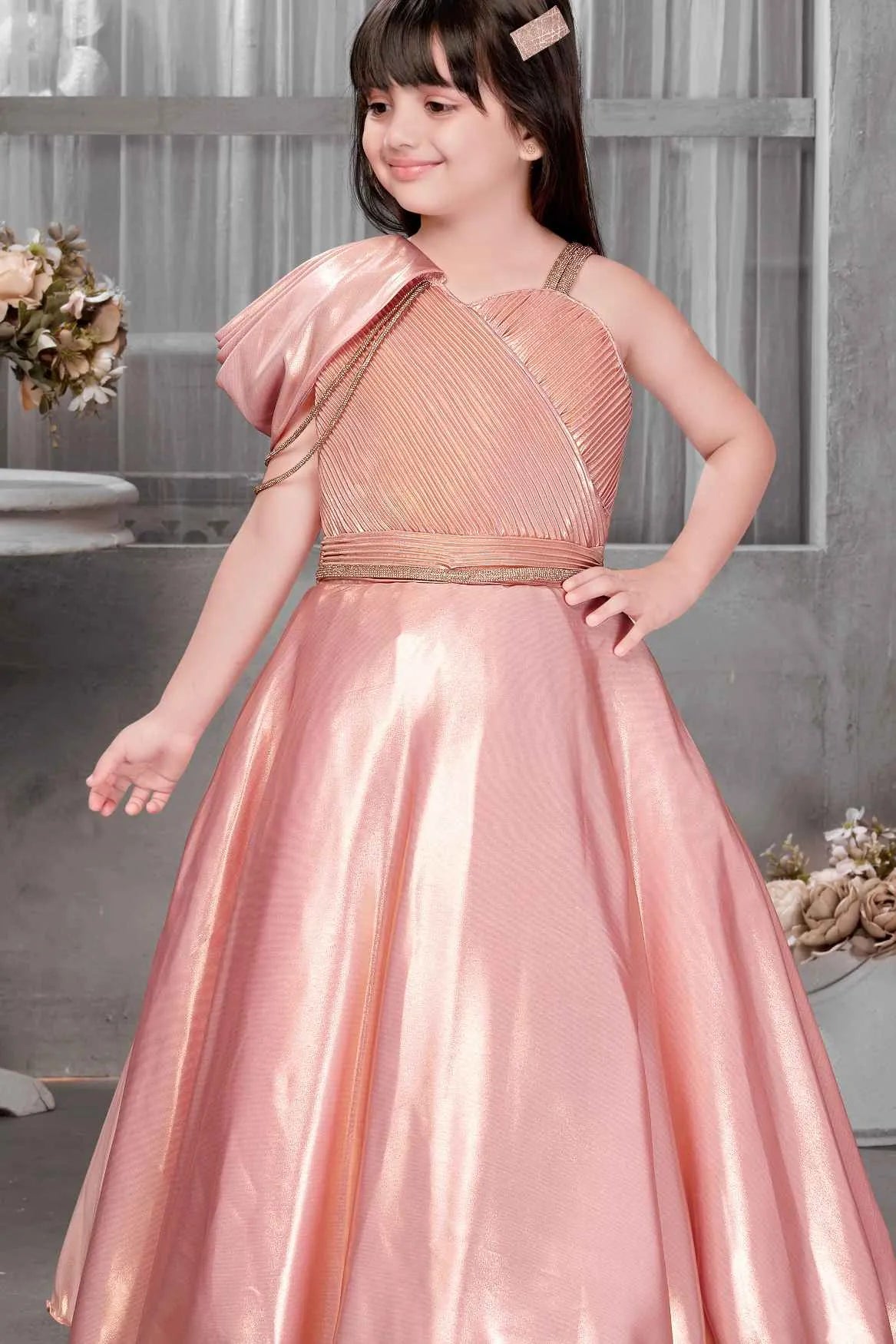 Shimmery Peach One-Shoulder Party Wear Gown With Draped Detail For Gir Lagorii Kids Shimmery Peach One-Shoulder Party Wear Gown With Draped Detail For Gir Lagorii Kids