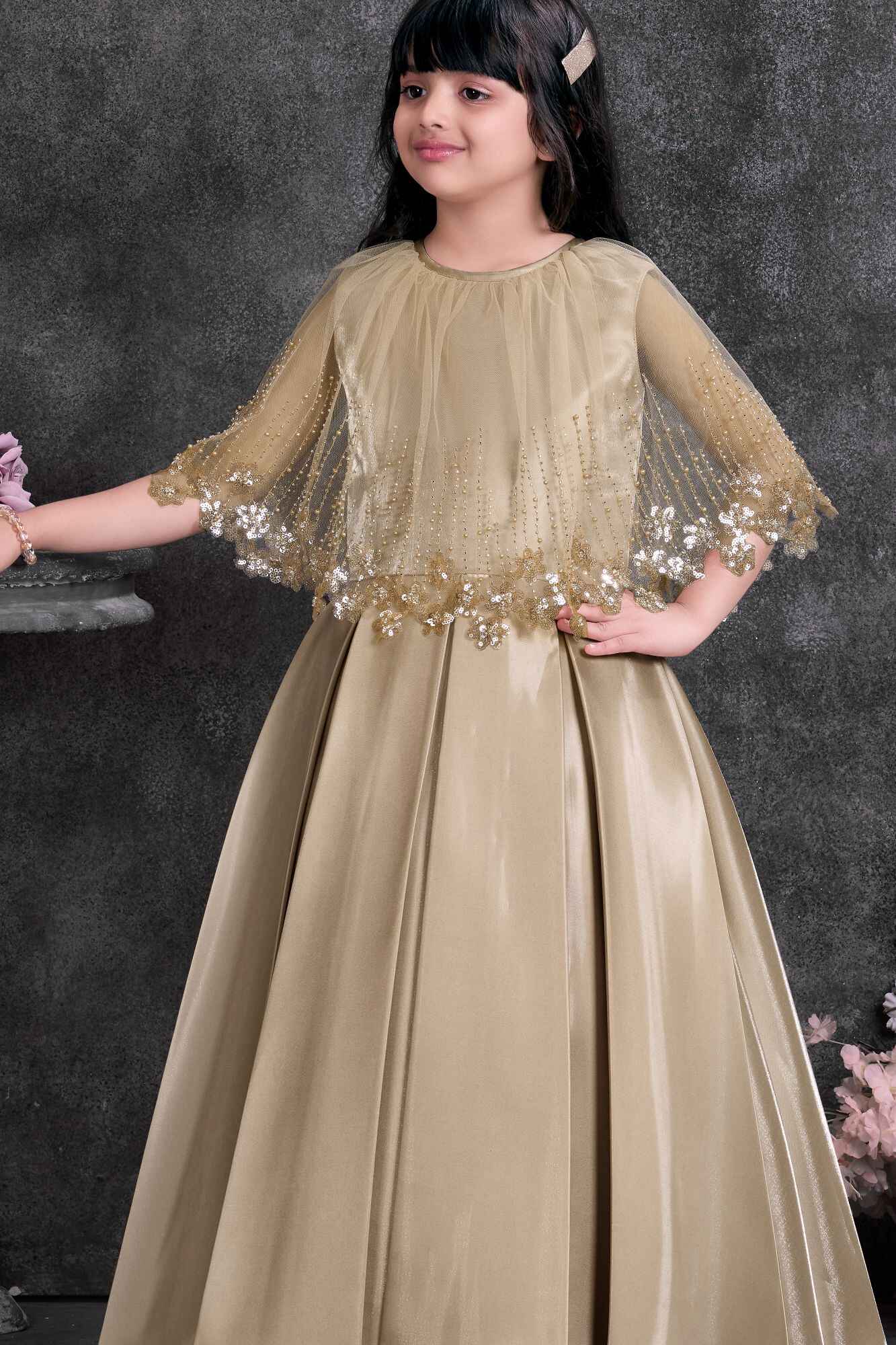 Gold Satin Party Wear Gown with Embellished Net Cape For Girls