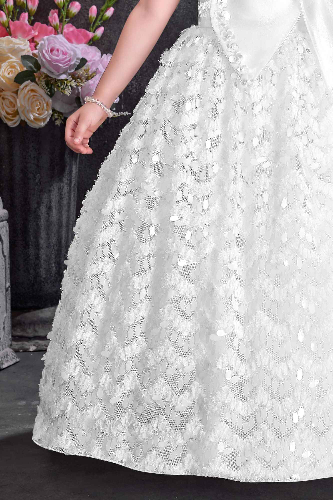 White Party Wear Gown with Statement Bow And Textured Skirt For Girls