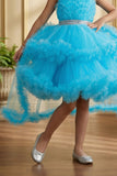 Girls Sky Blue High-Low Party Frock with Ruffled Layers And Embellished Waistbelt