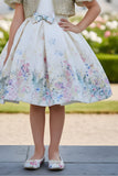 Ivory Floral Party Wear Frock with Golden Jacket And Bow Waist Accent For Girls