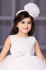 White Sleeveless With Pearl Work And Bow Embellishment Layer Frock For Girls