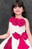 Girls White And Fuchsia Floral Applique Party Wear Frock with Bow Detail
