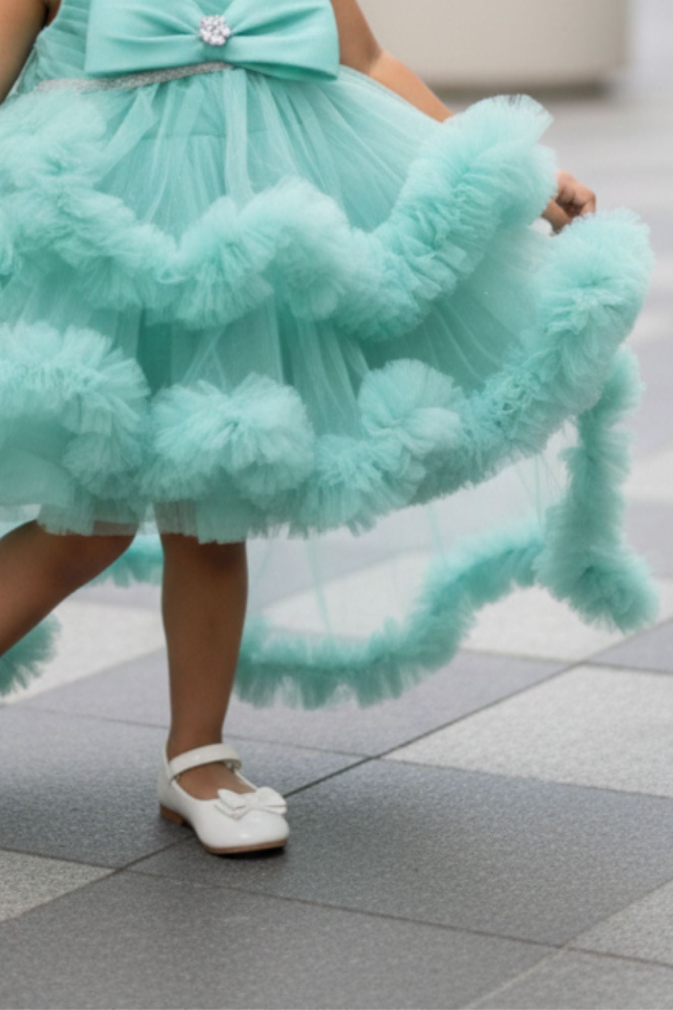 Green High-Low Party Wear Tulle Frock with Bow Detail For Girls