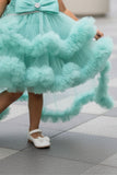 Green High-Low Party Wear Tulle Frock with Bow Detail For Girls