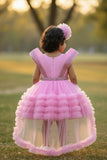 Pink Party Frock With Layered Ruffles And Statement Bow and Tailback For Girls