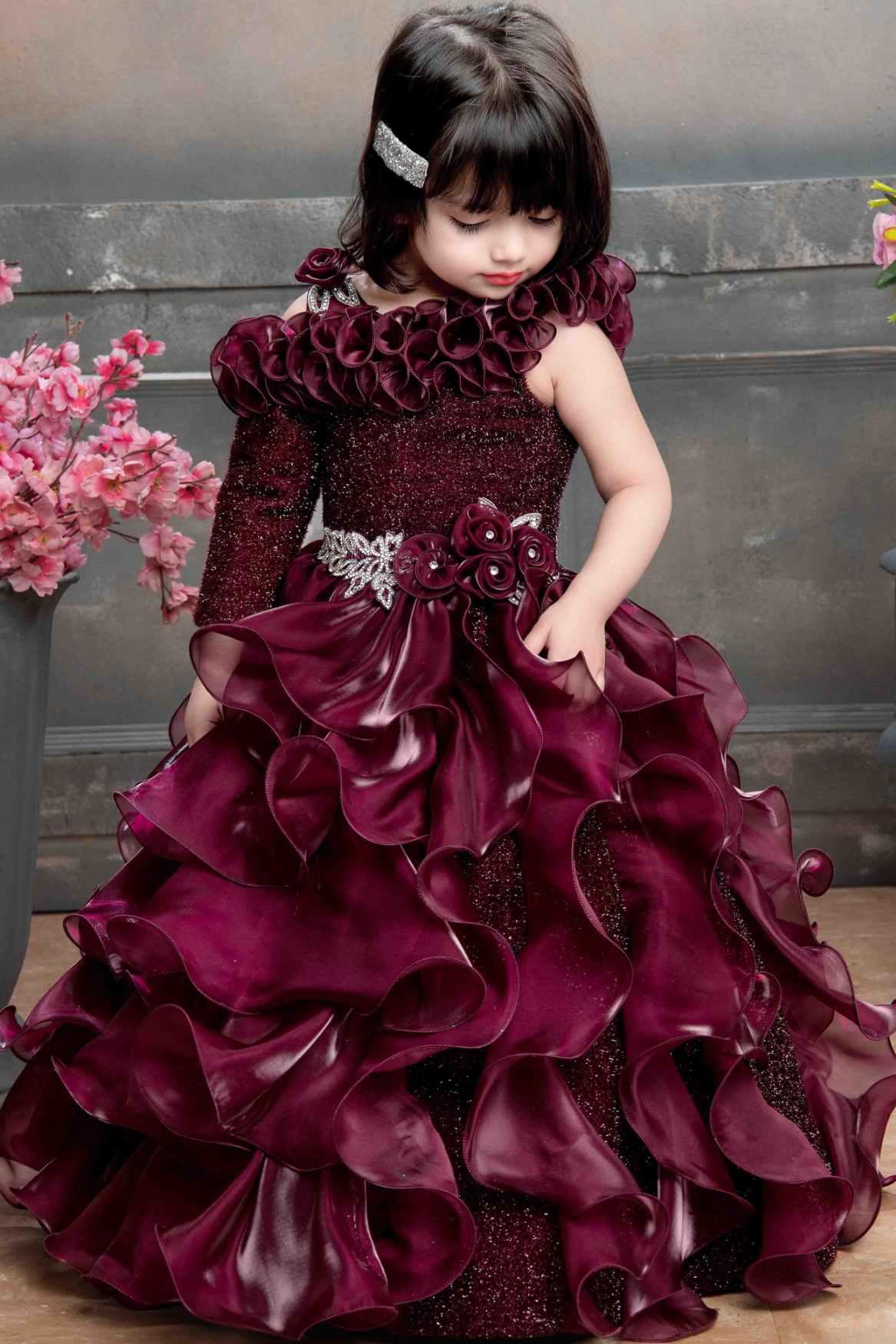 Designer Multilayer Ruffled Maroon Gown With Floral Embellishments For Girls - Lagorii Kids