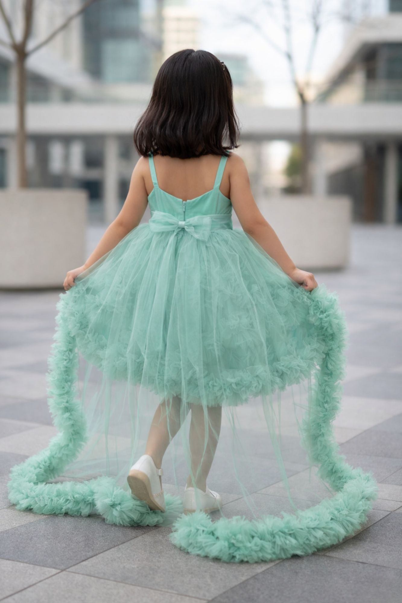 Green High-Low Party Wear Tulle Frock with Bow Detail For Girls