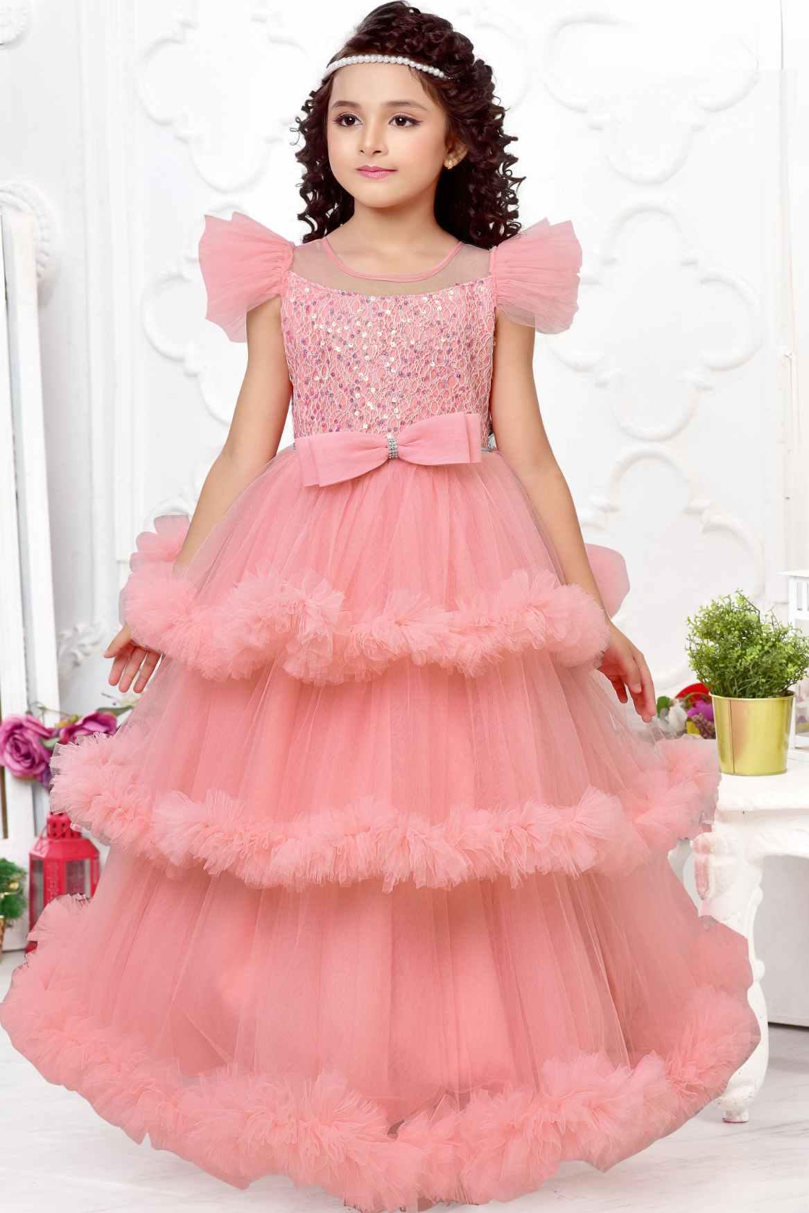 Peach Multilayered Ruffled Net Party Gown With Bow Embellishment For Girls - Lagorii Kids