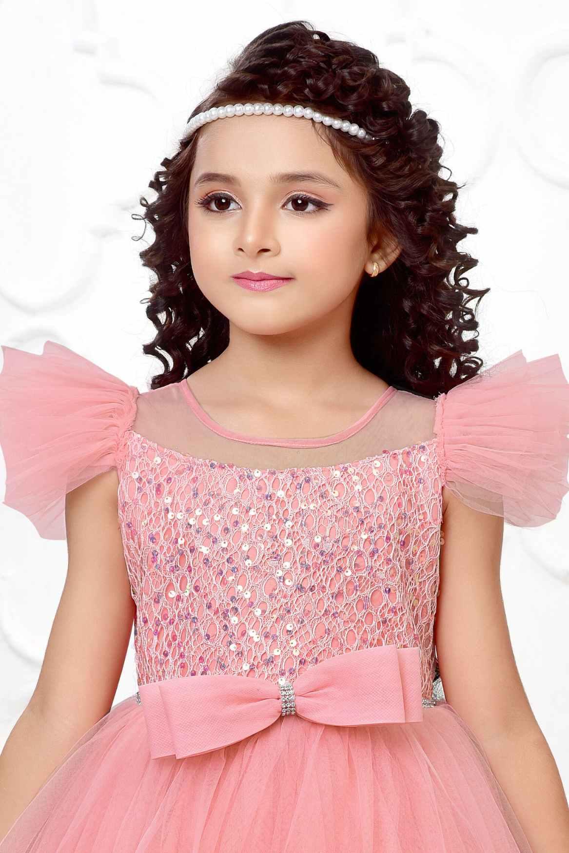 Peach Multilayered Ruffled Net Party Gown With Bow Embellishment For Girls - Lagorii Kids